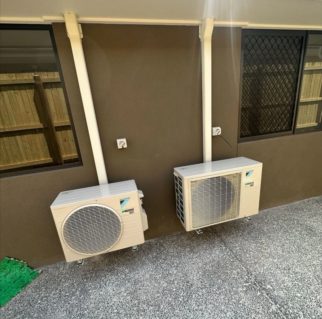 Two outdoor split-system units installed by Electrified